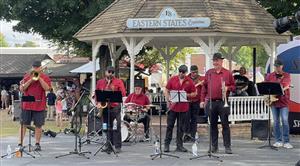 a 7 piece oompa band shown playing live at the Easter States Exposition band stand